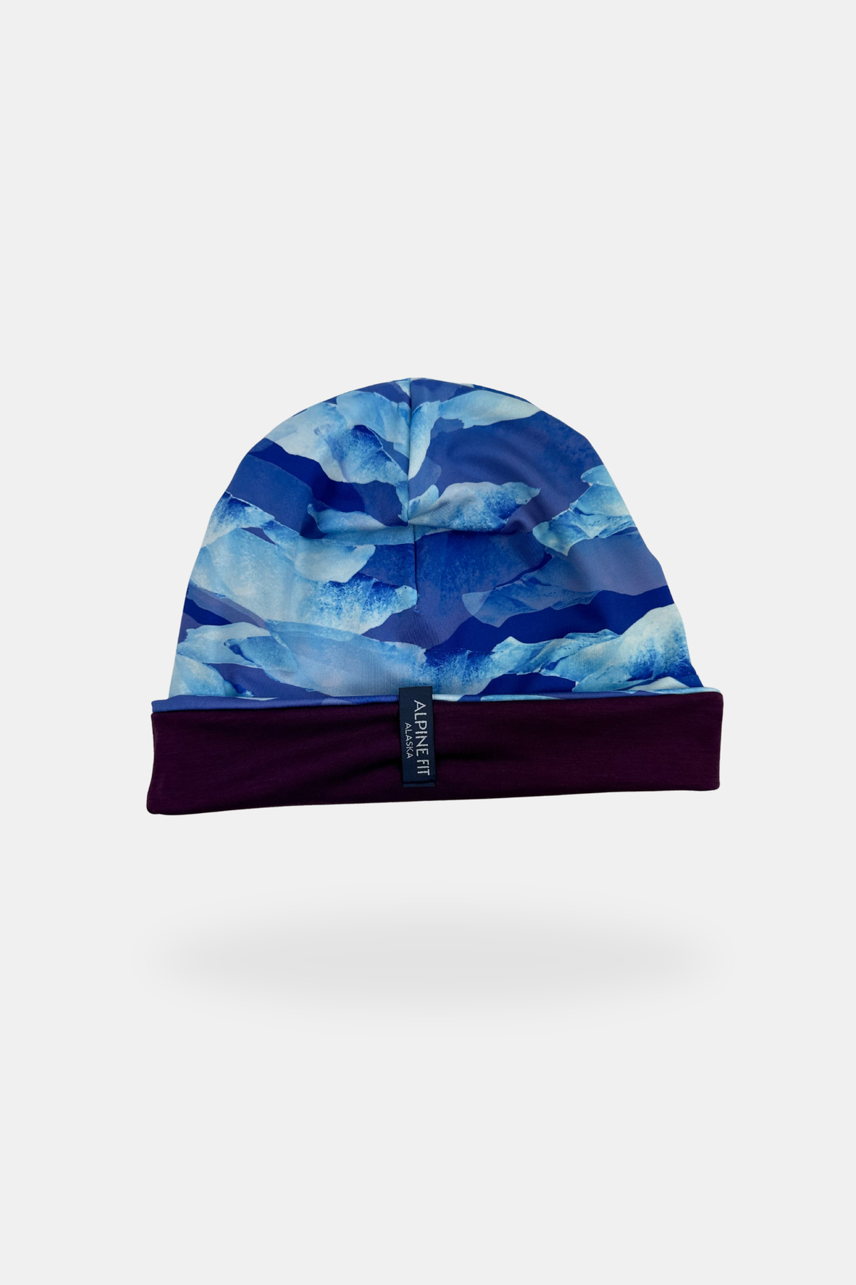 Alpine Fit Go All Winter Merino Wool Hat Glacial, Blue patterned beanie on a white background