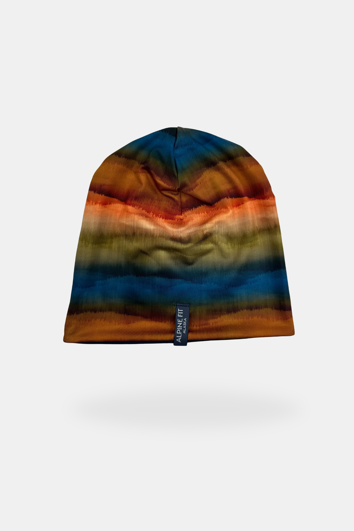Alpine Fit Go All Winter Merino Wool Hat Grasslands, Multicolored beanie with gradient pattern on a white background
