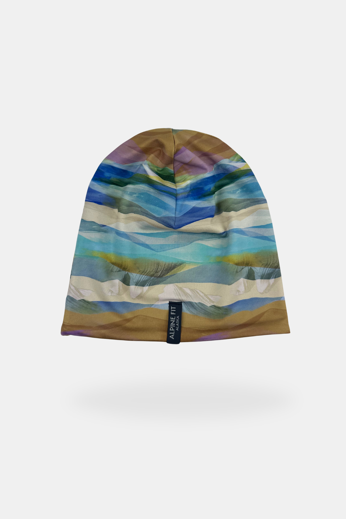 Alpine Fit Go All Winter Merino Wool Hat Rainbow Peak, Multicolored beanie with a pattern on a white background