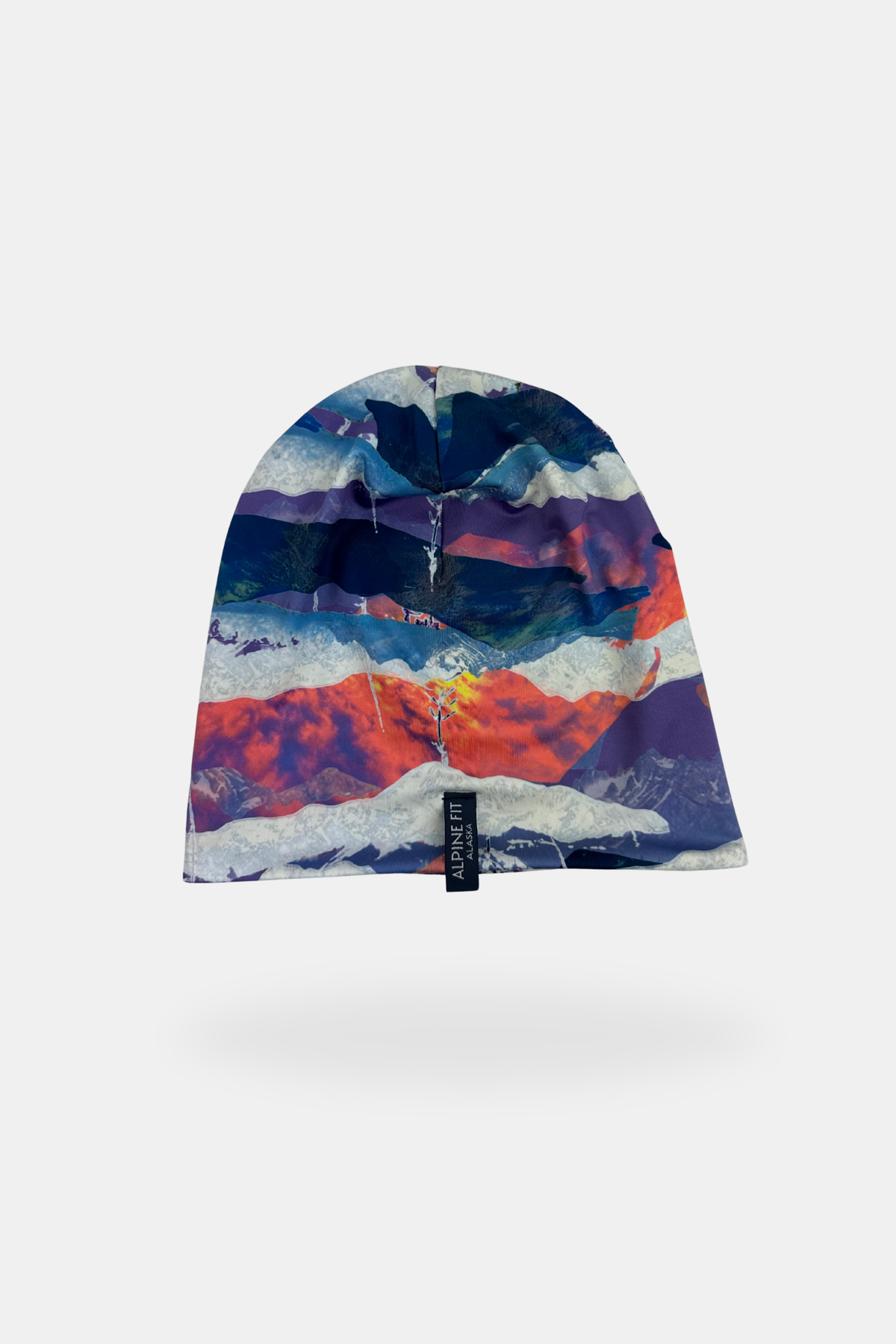 Alpine Fit Go All Winter Merino Wool Hat Sunrise, Colorful mountain-patterned beanie on a white background