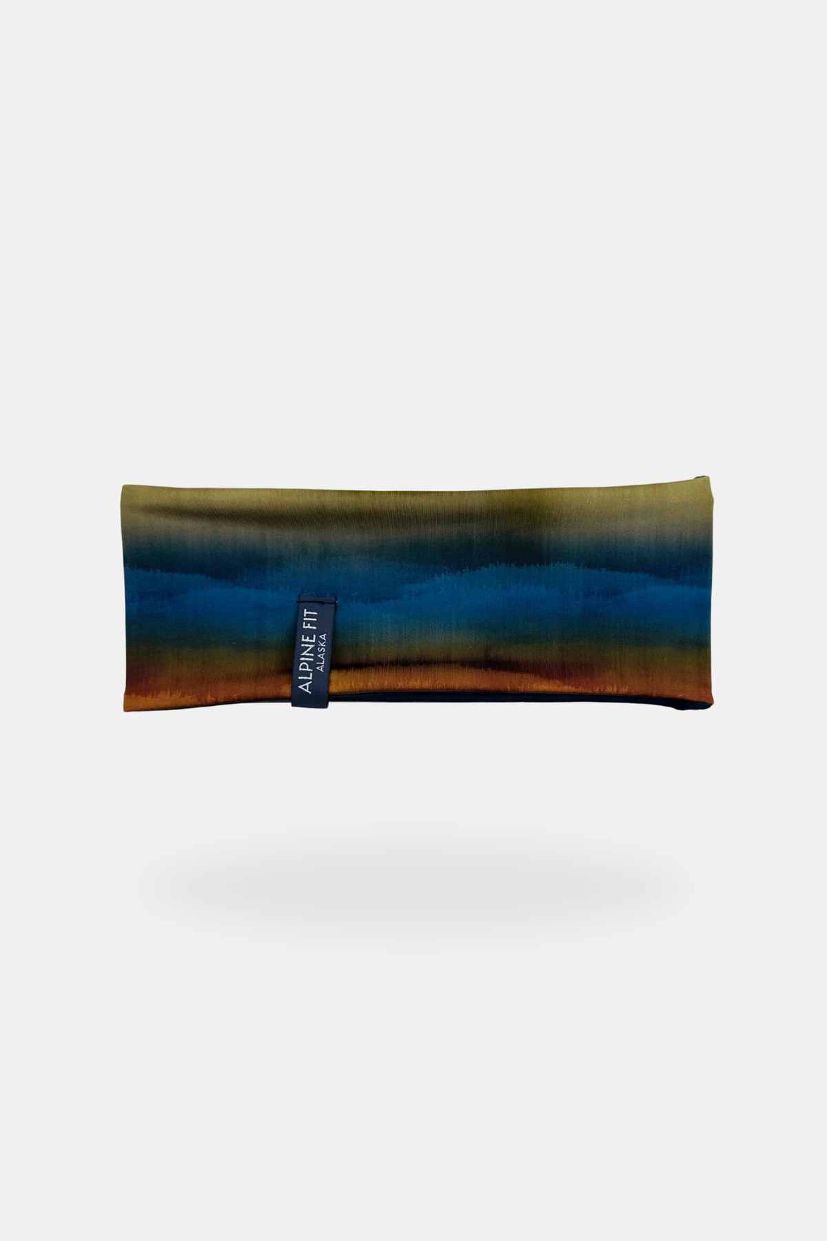 Alpine Fit Trailhead Cozy Fleece Headband Grasslands, Multicolored headband with a brand tag on a white background
