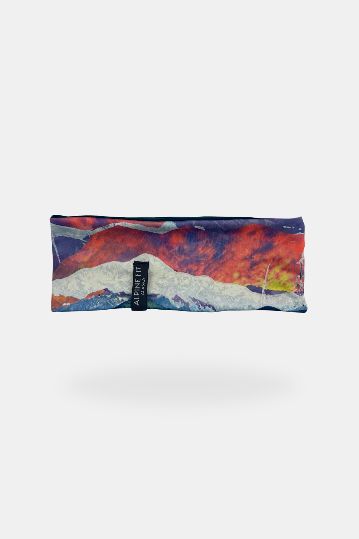 Alpine Fit Trailhead Cozy Fleece Headband Sunrise, Headband with mountain and sky design on a white background