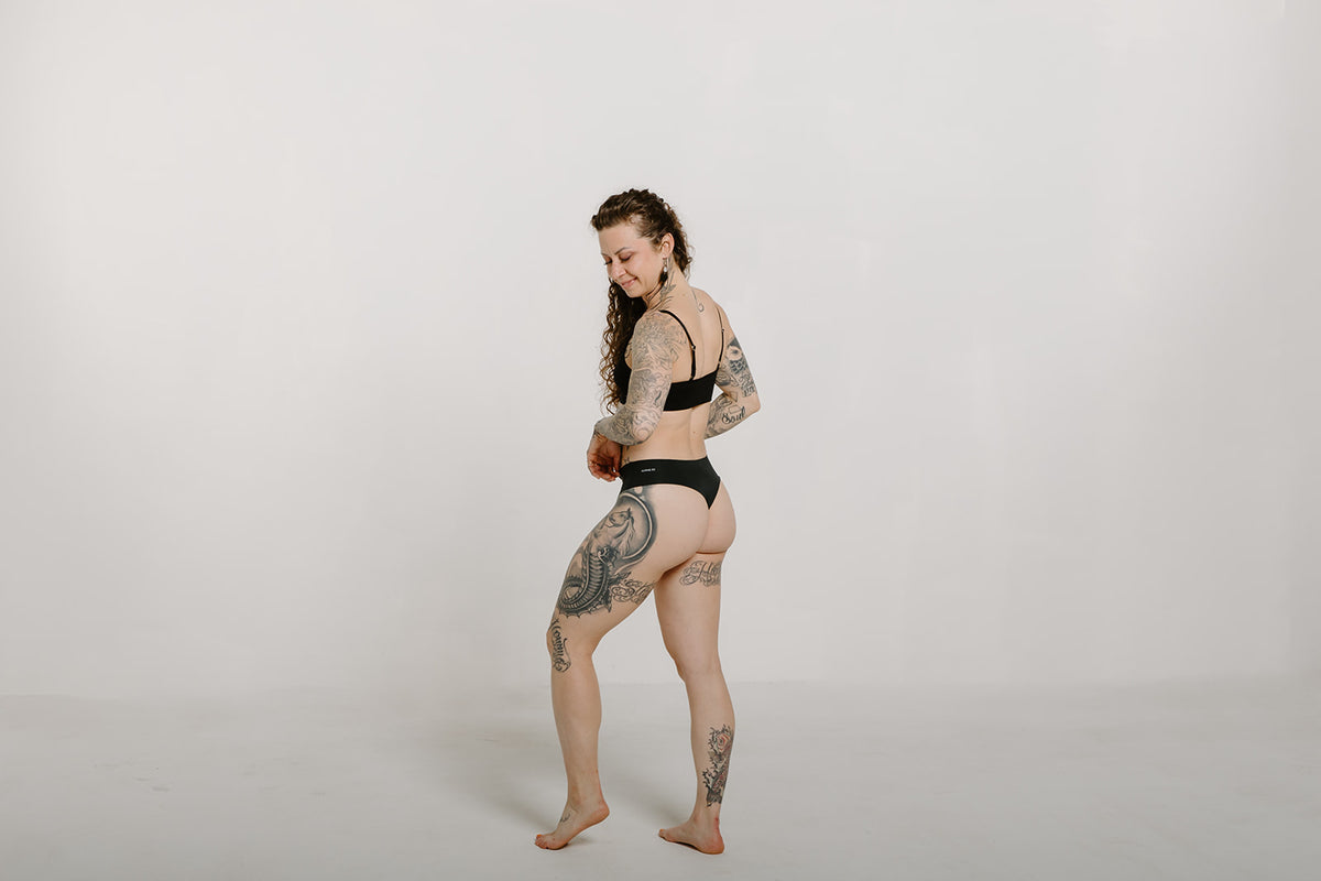 Alpine Fit Athletic Thong Obsidian Cove Black, Woman wearing athletic thong full back view