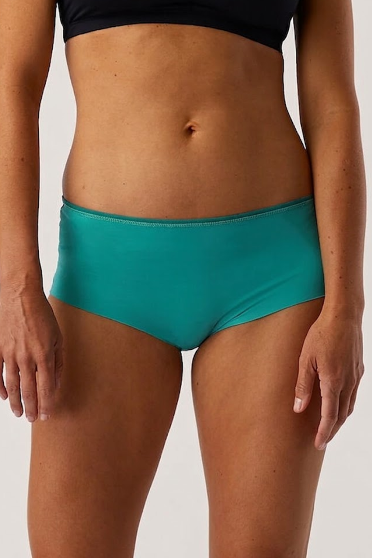 Alpine Fit Athletic Hipster Glacial Teal, Person wearing teal high-waisted hipster on a plain background