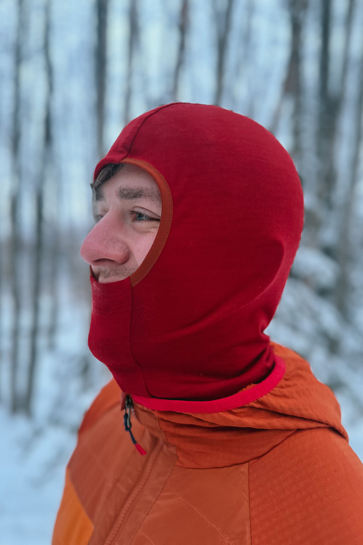 Alpine Fit Merino Wool Balaclava Rust, Man wearing balaclava on snowy background