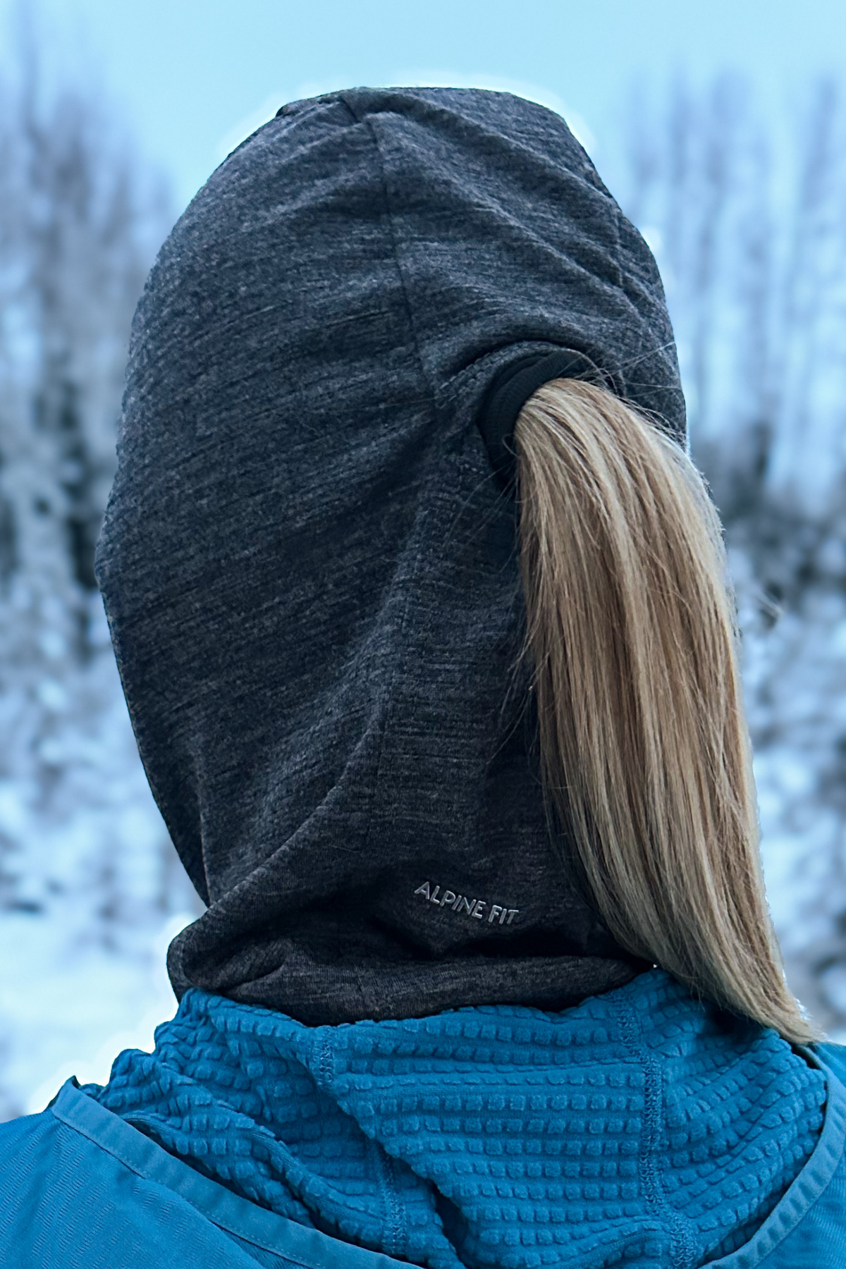 Alpine Fit Merino Wool Balaclava Charcoal Grey, Close up of woman wearing balaclava while showcasing pony tail exit