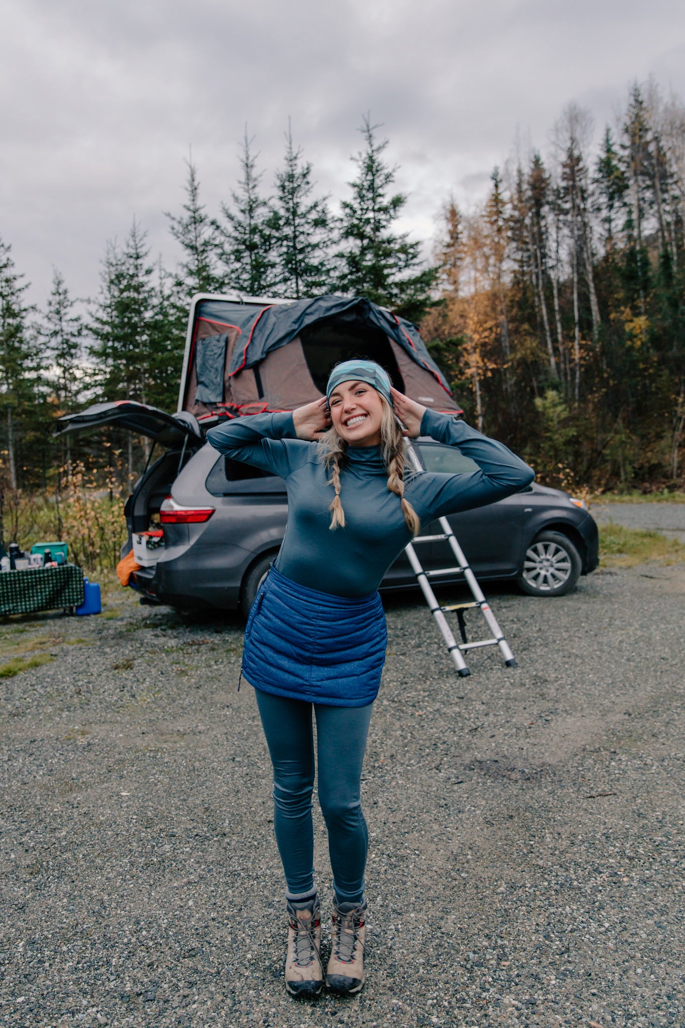 alpine fit merino wool base layer top and bottom on model camping outside