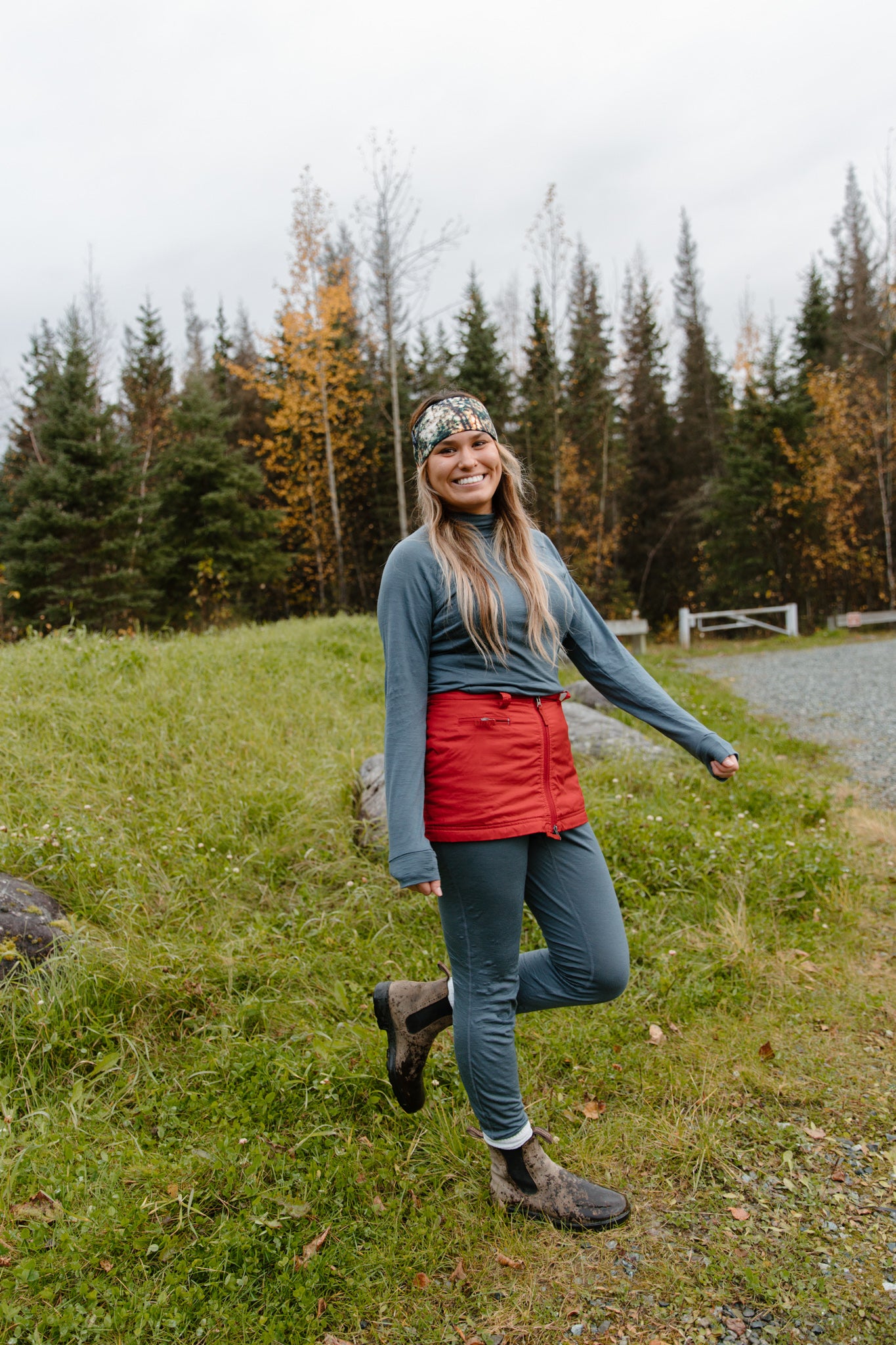 alpine fit merino wool base layer top and bottom on model outside with cute headband