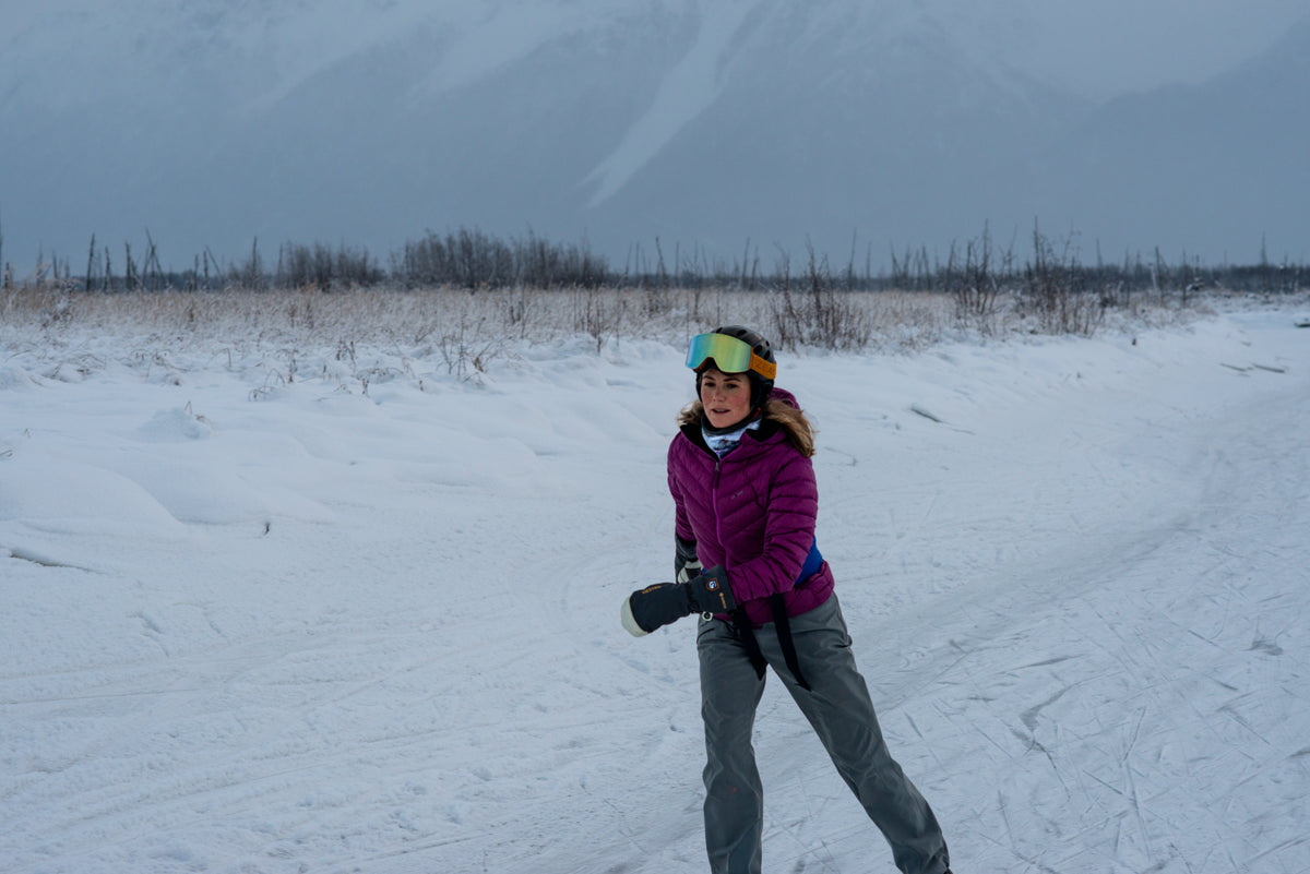 alpine fit fleece lined neck gaiter on model outside ice skating