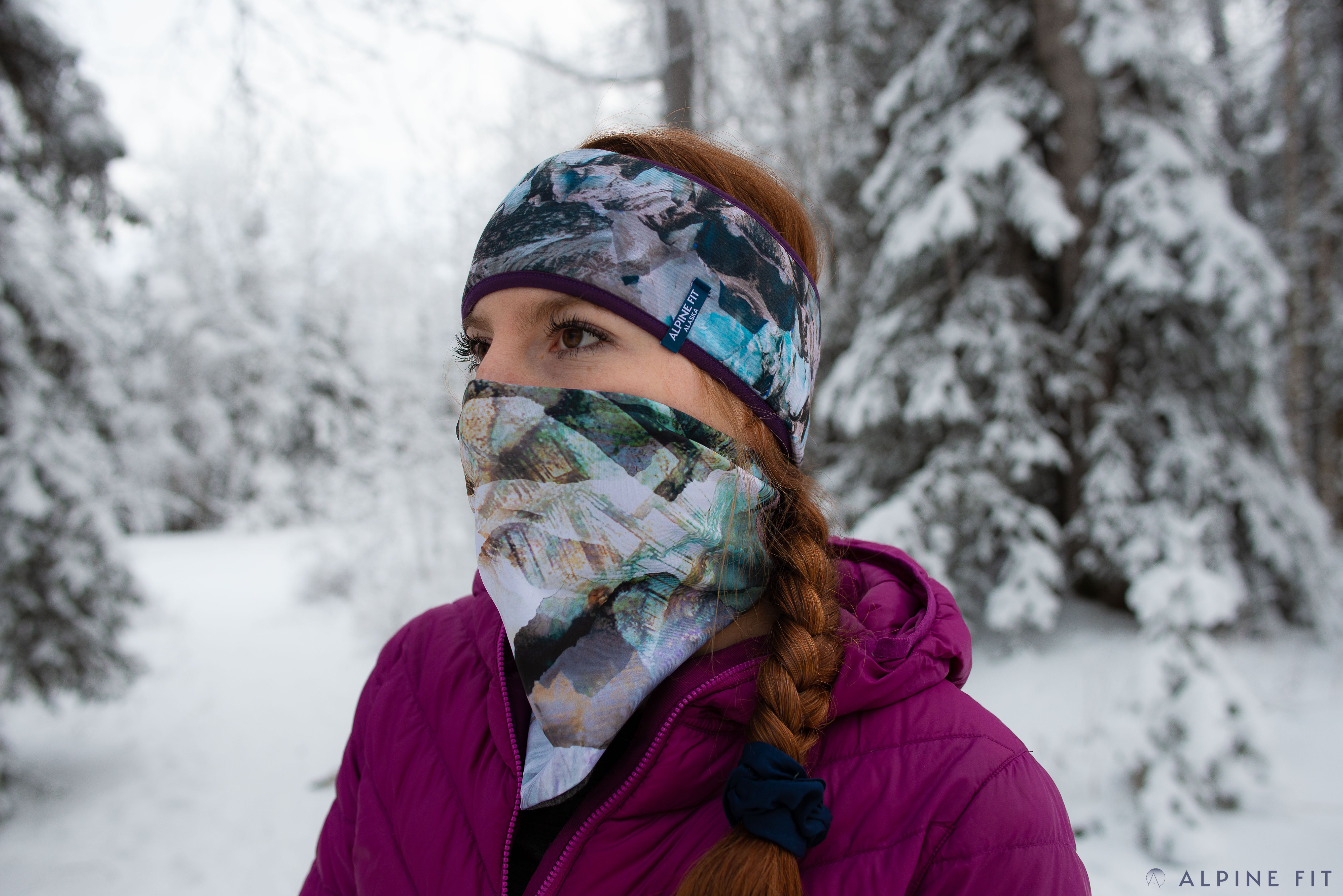 alpine fit neck gaiter on model outside in winter with headband
