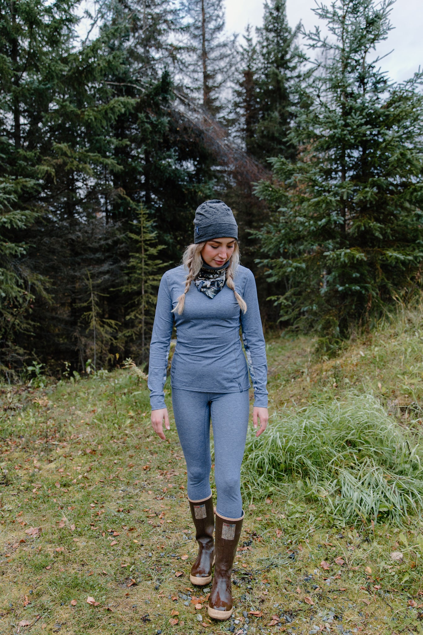 alpine fit long sleeve base layer blue on model outside with top and bottom