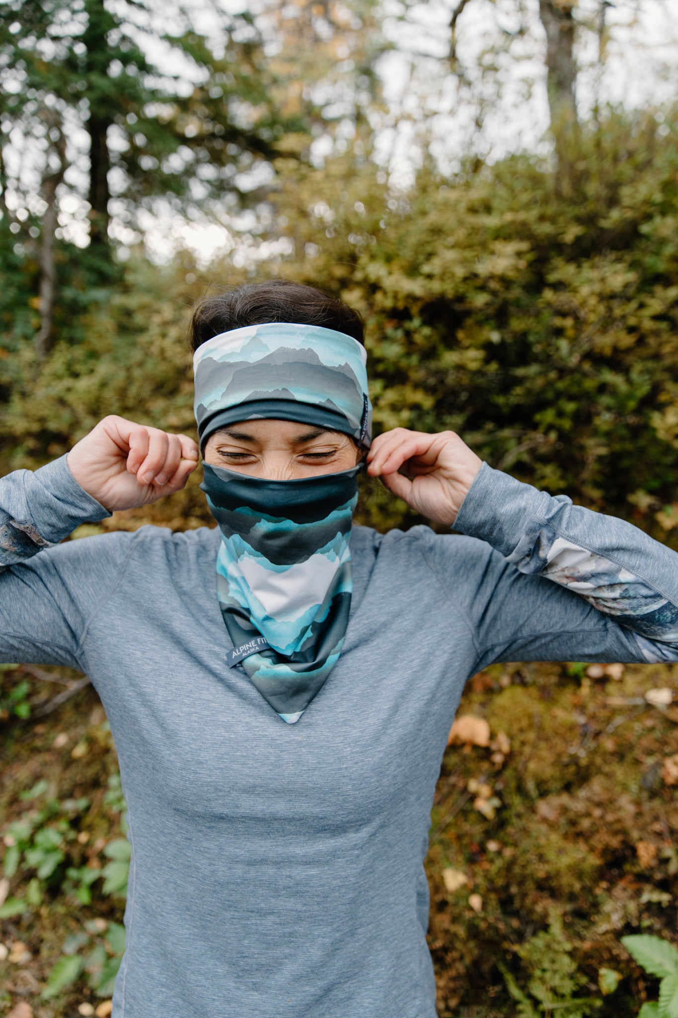 alpine fit fleece lined headband on model outside with neck gaiter