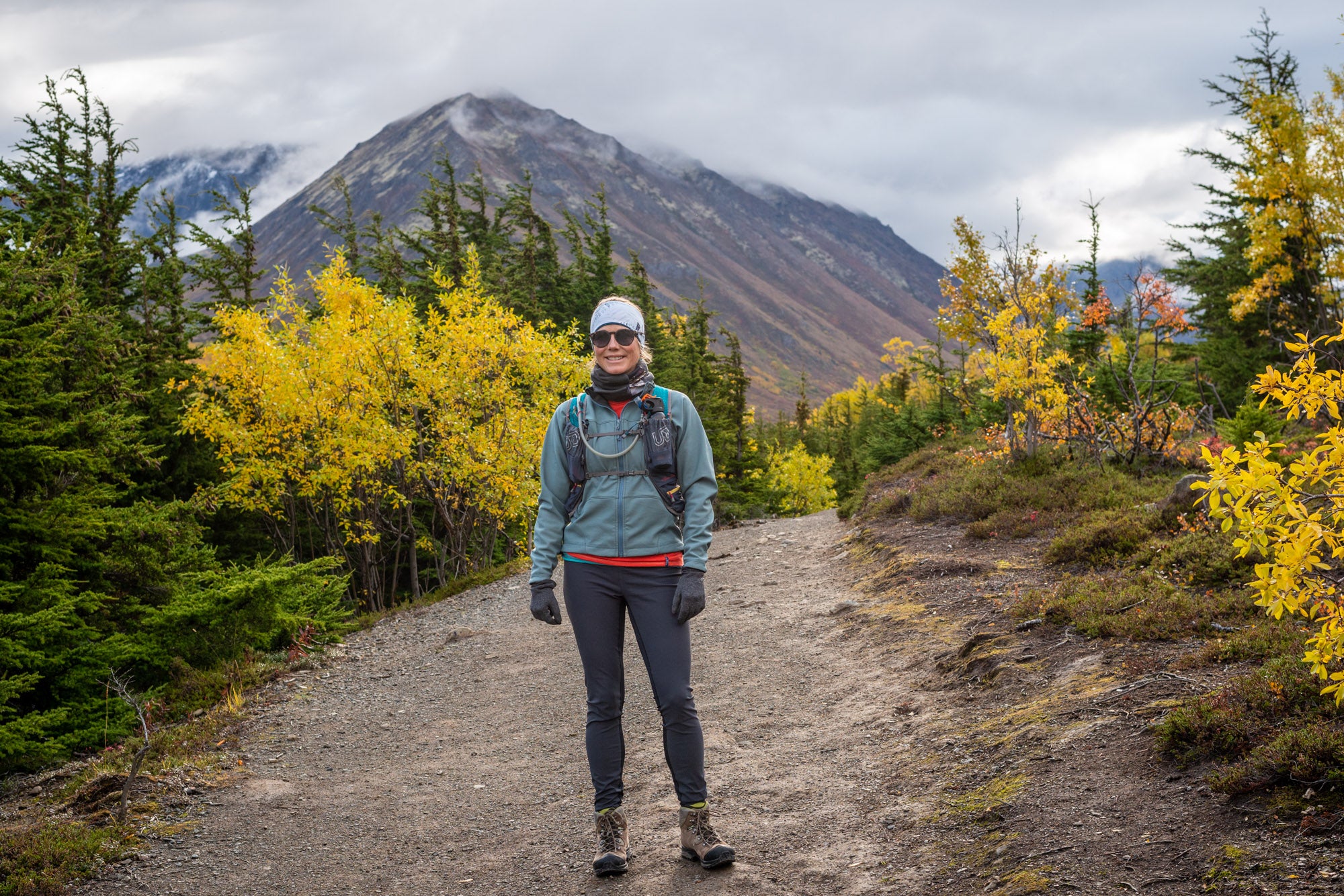 alpine fit hiking leggings on model outside in autumn with headband