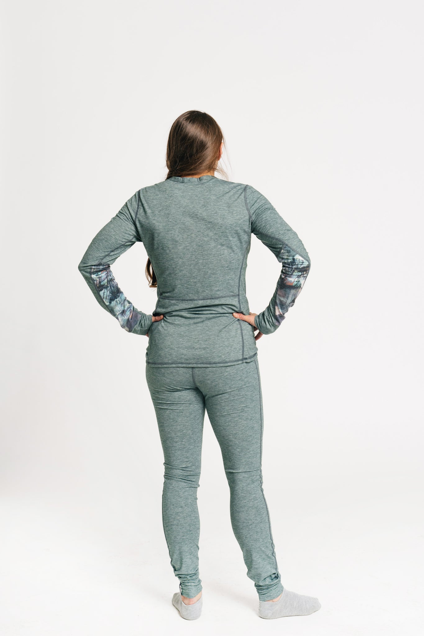 alpine fit green base layer top and bottom viewed from the back