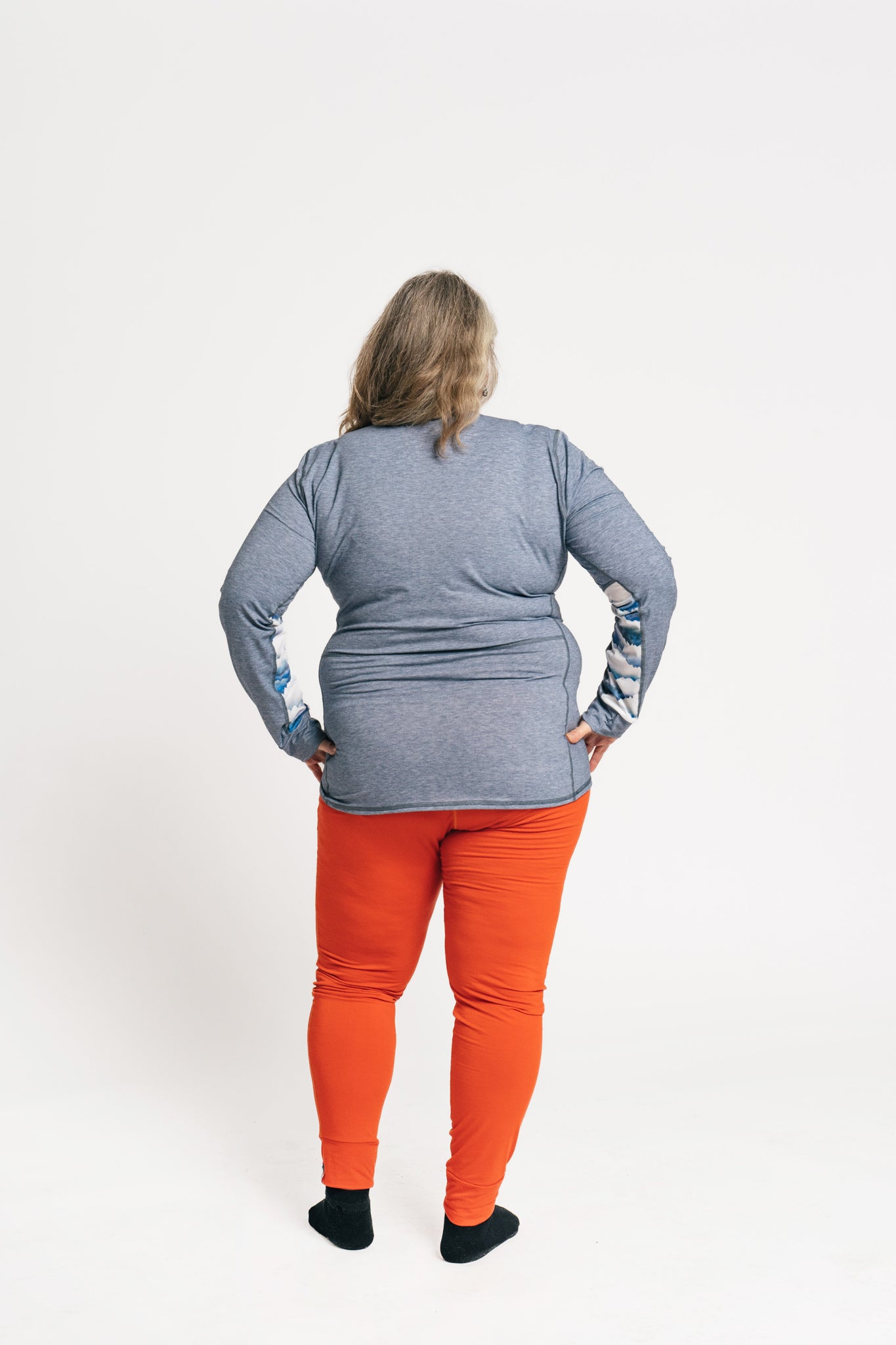 alpine fit base layer top and bottom plus size model viewed from the back