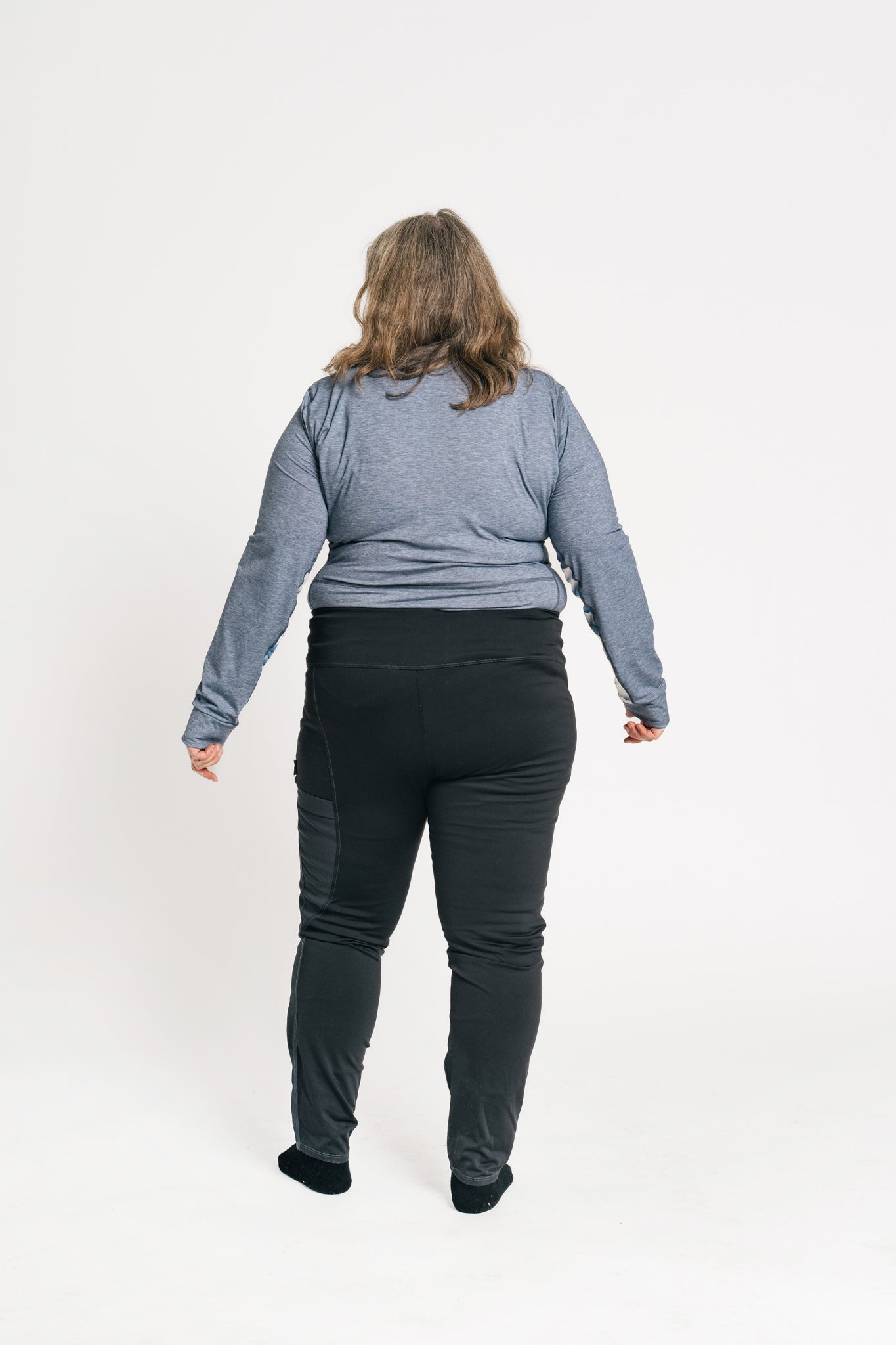 alpine fit long sleeve base layer blue on model viewed from behind plus size