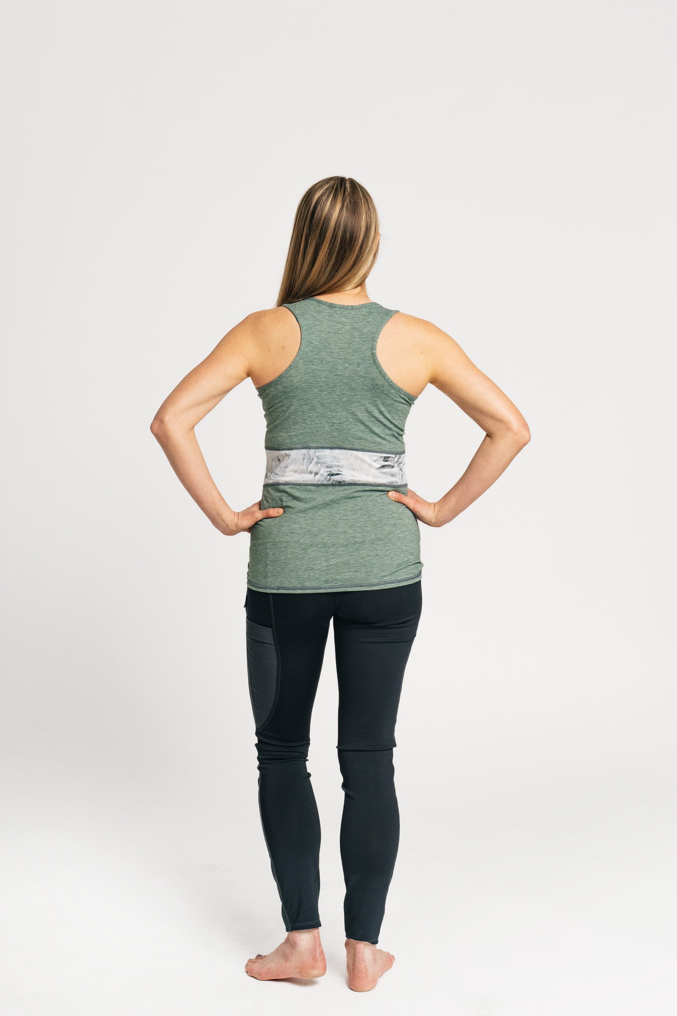 alpine fit tank top on model viewed from behind