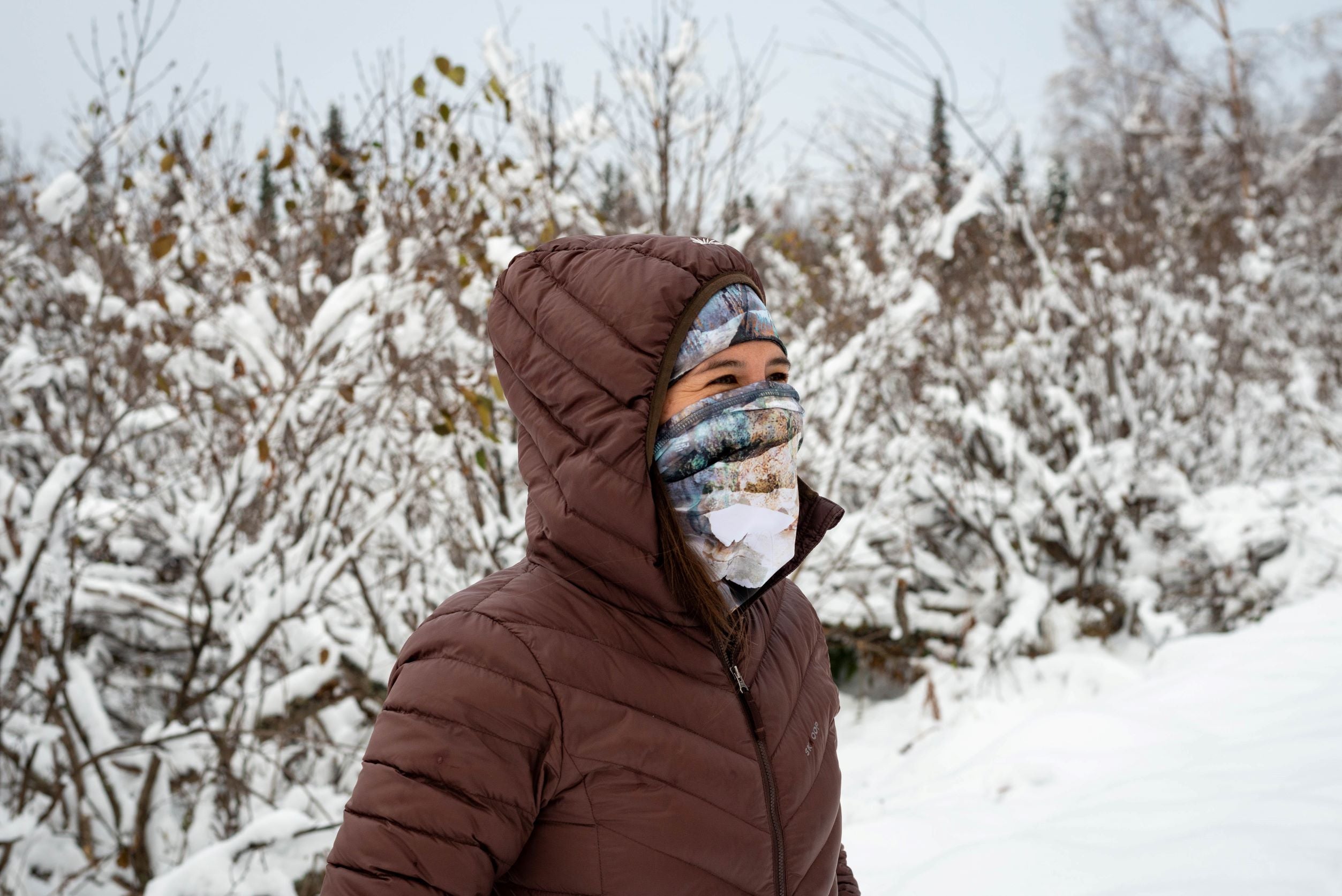 alpine fit merino wool headband in winter outside with neck gaiter