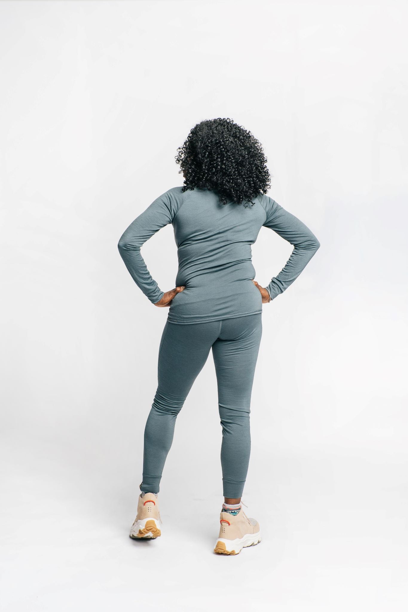alpine fit merino wool base layer top and bottom on model back view
