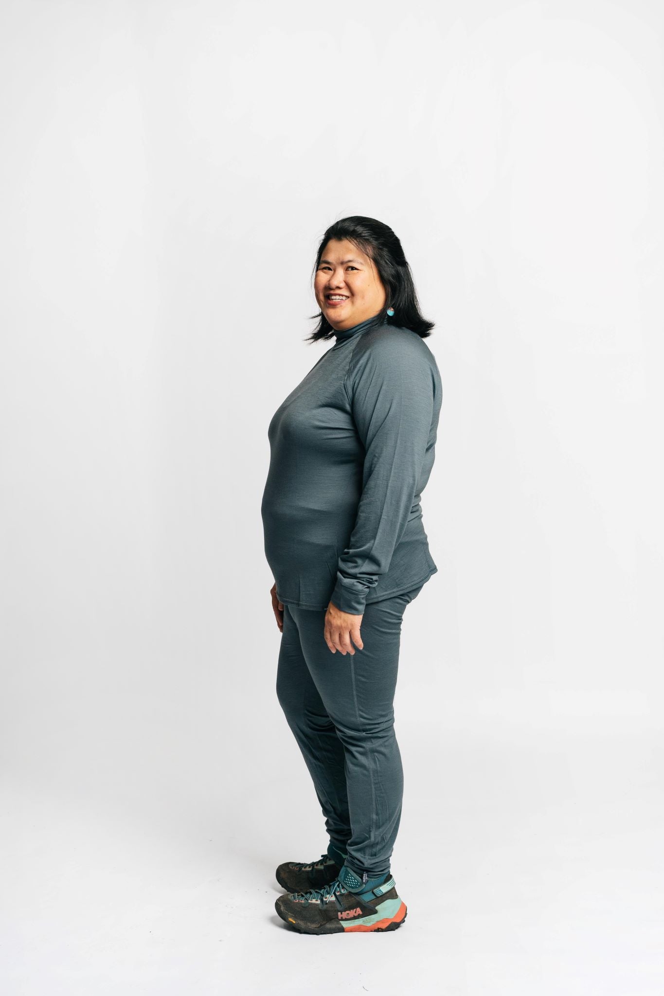 alpine fit merino wool top and bottom on plus size model side